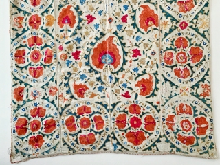 A beautiful antique Uzbek silk suzani from 19th century Bukhara. Boasting a rich floral field design with an array of palmettes, interspersed with vines and smaller floral repertoires. The borders have large  ...