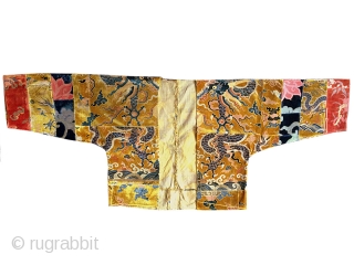 An rare antique Tibetan silk velvet Lama Jacket. It dates possibly to early 19th Century. It's somewhat patched work construction is deliberate as Lama's often wore garments made of patches of textiles  ...