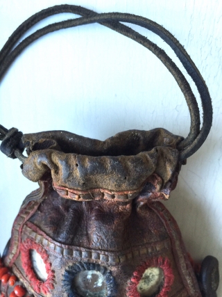 A very rare antique Beaded leather bag from Tibet or Ladakh India. Dating to the 19th century, such bags were part of the Buddhist traditions of the Hamaliyan people. The blood red  ...