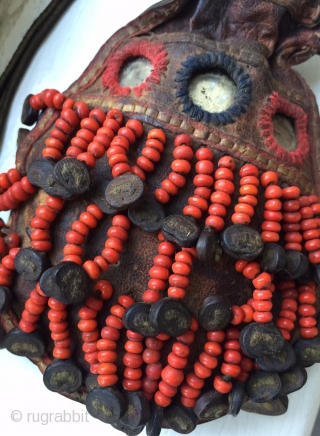 A very rare antique Beaded leather bag from Tibet or Ladakh India. Dating to the 19th century, such bags were part of the Buddhist traditions of the Hamaliyan people. The blood red  ...