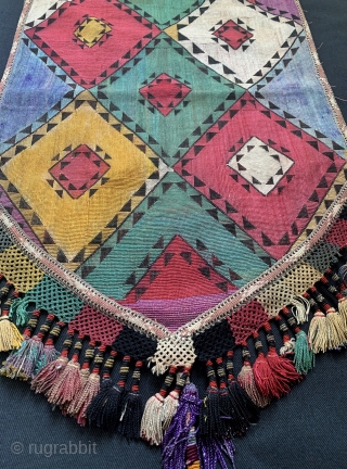 An excellent example of Antique Uzbek Lakai tribe silk cross stitched shield shaped talismanic hanging known as Uut Kap Ilgich, dating to the 19th century. This is one of the coveted examples  ...