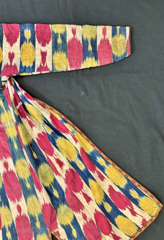An elegant Antique Uzbek Ikat Robe Chapan  from Bokhara / Bukhara. It is an adras Ikat (silk warp/cotton weft) from early third quarter of the19th Century. The design is relatively unique  ...