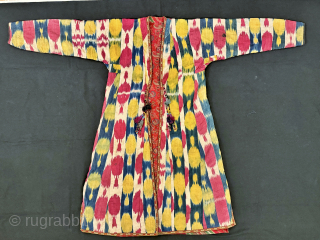An elegant Antique Uzbek Ikat Robe Chapan  from Bokhara / Bukhara. It is an adras Ikat (silk warp/cotton weft) from early third quarter of the19th Century. The design is relatively unique  ...