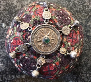 A rare complete antique silk embroidered Yomud / Yomut tribe Turkoman / Turkmen young man / boy's hat with original gold appliqué on silver  talismanic crown. There is a distinctive beauty  ...