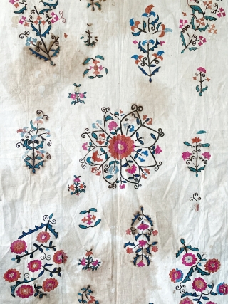 A beautiful antique Uzbek Nurata silk embroidered suzani / susani , dating to the last 19th Century. It is relatively large piece with flat stitched (basma stitched) silk embroidery on a cotton  ...