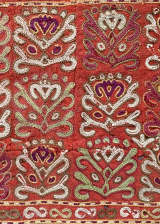 An exceptional antique Turkoman Turkmen Chodor tribe silk embroidered sleeve (opened) dating to the19th century. Chodor silk needlework were often done on red bannat trade cloth and were some of the finest  ...