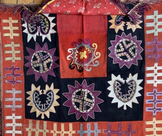 An excellent antique Uzbek Lakai silk embroidered ayna khalta / ilgich, dating to late 19th century. This envelope shaped talismanic hanging with a false flap represents the wedding ceremonial mirror bags. This  ...