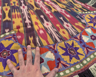 An excellent and very rare antique Uzbek silk embroidered Ikat ceremonial saddle cover, made in rural areas of Shahrisabz during the 19th century. This fine horse cover was a likely a bridal  ...