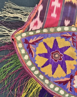 An excellent and very rare antique Uzbek silk embroidered Ikat ceremonial saddle cover, made in rural areas of Shahrisabz during the 19th century. This fine horse cover was a likely a bridal  ...