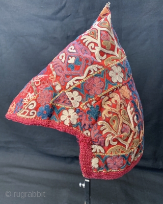 An exceptional antique Turkoman Turkmen Chodor tribe silk embroidered hat dating to the 19th century. Though the hat is somewhat fragmented, I think it was reduced from a larger hat and done  ...