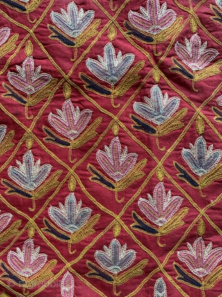 A fine antique Indian silk embroidered hanging from Gujarat (turned into a functional pillow). It dates around 1900  and is a really fine work of textile art. The red field is  ...