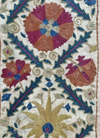 An excellent antique Uzbek silk suzani from Nurata dating between mid and early 3rd quarter of 19th century. Boasting a rich floral field design embroidered using fine polychrome silks chain-stitched on a  ...