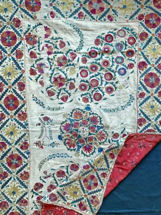 An excellent antique Uzbek silk suzani from Nurata dating between mid and early 3rd quarter of 19th century. Boasting a rich floral field design embroidered using fine polychrome silks chain-stitched on a  ...