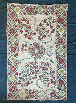 An excellent antique Uzbek silk suzani from Nurata dating between mid and early 3rd quarter of 19th century. Boasting a rich floral field design embroidered using fine polychrome silks chain-stitched on a  ...