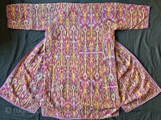 An excellent Antique Central Asian Adras Ikat Chapan / Robe made by the Tajik people of Ferghana Valley / Kokand region. It dates to the early third quarter of 19th century.   ...