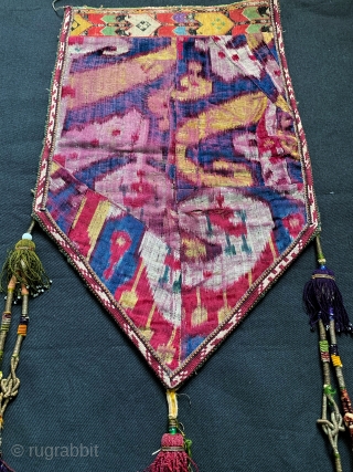 A beautiful antique Uzbek ilgich tent hanging made of silk velvet / bakhmal Ikat face with silk needlepoint embroidery on the trim and silk embroidered back side. It dates to last quarter  ...