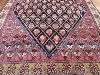 A thick gabbeh/yatak type rug, possibly Kurdish from North West Persia. 185 x 136 cm. Luminous natural colours and long-staple glossy wool on a cotton foundation. There is an old repair to  ...