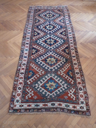 A vibrant Karabagh Kazak, late 19th Century. 258 x 110 cm. The ends are rewoven and there is some old repiling, but overall in good condition.       