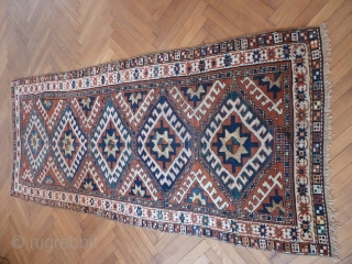 A vibrant Karabagh Kazak, late 19th Century. 258 x 110 cm. The ends are rewoven and there is some old repiling, but overall in good condition.       