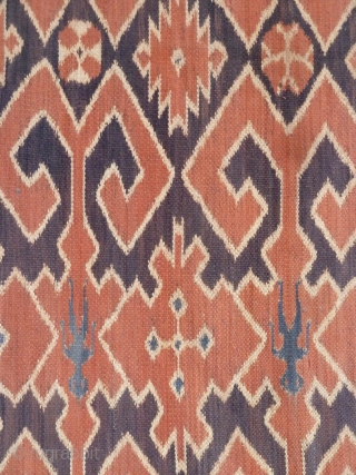 A Toraja Sulawesi ceremonial cloth, joined cotton lengths in warp ikat technique. Indonesia, mid 20th Century. Note the human figures interspersed between the geometric motifs.        