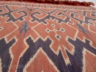 A Toraja Sulawesi ceremonial cloth, joined cotton lengths in warp ikat technique. Indonesia, mid 20th Century. Note the human figures interspersed between the geometric motifs.        