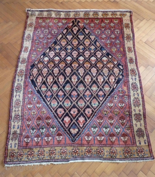 An unusual Northwest Persian rug, early 20th Century. Flower filled lattice design. Repair at one end, otherwise great condition. All good colours and very soft wool. 190 x 137 cm   