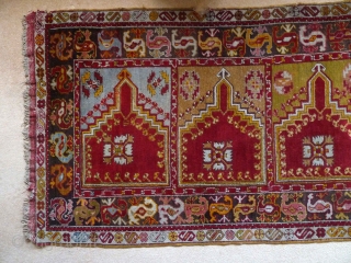 A charming central Anatolian prayer saph, c.1900, with a typically vivid palette. 320 x 103 cm. It is in very good condition, with a little loss at one end, a small bite  ...