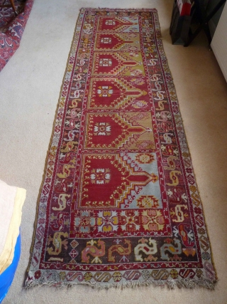 A charming central Anatolian prayer saph, c.1900, with a typically vivid palette. 320 x 103 cm. It is in very good condition, with a little loss at one end, a small bite  ...