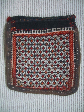 A charming small Qashqai chanteh, late 19th century. During its working life the bag has been reinforced with a rawhide strip around the edges. The velcro strip across the top of the  ...