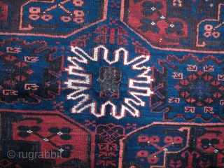 Probably Timuri, Baluch Main Carpet, late 19th century. Very unusual "Gulli Gul" design. Remnants of silk highlights in center flower. Some corrosion of browns, but overall condition is very good. Some minor  ...