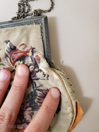 This beautiful handwoven french purse is not in great condition. Lots of tearing alongside the handbag; main print on face still intact.           