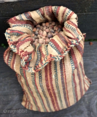 Four pre-Columbian food bags with original contents.  South coastal Region of Peru.  A.D. 500 - A.D. 1200, but it is hard to determine exactly without doing a c14 measurement.   ...