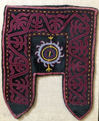 Khirgiz decorative felt stirrup cover.  20th century. Probably for ceremonial usage.   It was constructed using a natural brown, wool felt base, then applied with black velvet cloth and embroidered  ...
