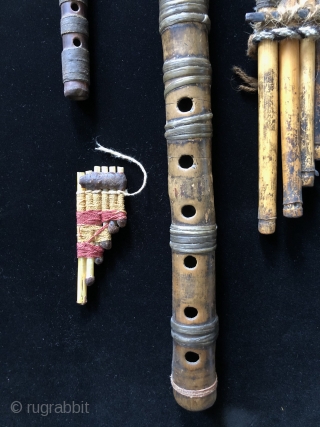 Andean Wind Instruments. For millennia Andean people have been playing wind instruments. Music was a vital part of Andean ritual and ceremony.  Seen here are two Pre-Columbian panpipes and two flutes  ...