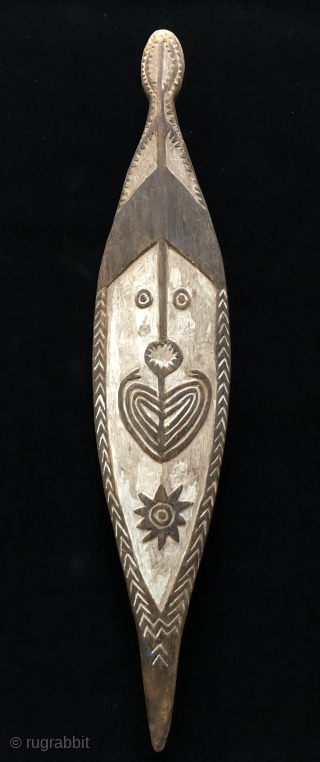 Papua New Guinea Spirit board (gope).  Size: 26 x 5.5 x 2 inches.  Wood plank carved in low relief.  Applied white lime with traces of red ochre remaining.
*Description that  ...