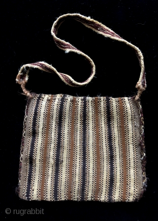 Complete warp-faced patterned Andean coca bag.  A.D. 900 - 1200. The design is primal - made by simply alternating warp yarns to create a "zipper-like" pattern.  This is a way  ...