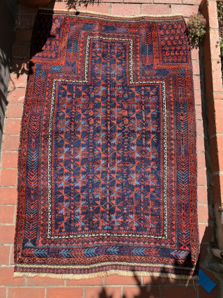 Baluch prayer rug.  19th century. Large and with electric light blues.  Complete and in very good condition. Size: 65 x 40 inches.         
