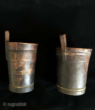 Two ancient Wooden Drinking vessels (kero) from the altiplano region of Bolivia. Ritual drinking and feasting was a vital part of Andean culture and was the glue that fostered and cemented relationships  ...