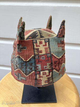 Exceptional and rare Pre-Columbian four cornered hat. Tiwanaku Culture, Bolivia, Chile or Peru. a.d. 600 – a.d. 900. This hat was created in a tight looping structure using fine alpaca yarns. This  ...