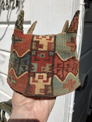 Exceptional and rare Pre-Columbian four cornered hat. Tiwanaku Culture, Bolivia, Chile or Peru. a.d. 600 – a.d. 900. This hat was created in a tight looping structure using fine alpaca yarns. This  ...