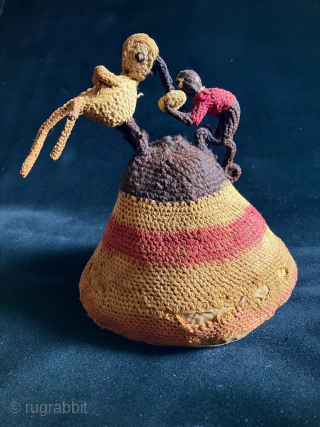 Unique and charming Pre-Columbian hat with three dimensional bird and monkey figures fighting for possession of a what appears to be a peanut or small fruit.  A.D. 900 - 1400.   ...