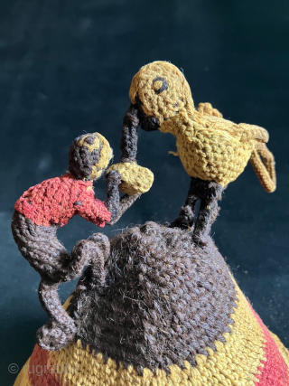 Unique and charming Pre-Columbian hat with three dimensional bird and monkey figures fighting for possession of a what appears to be a peanut or small fruit.  A.D. 900 - 1400.   ...