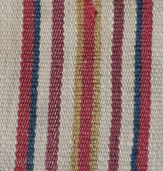 A unique, white ground Aymara Ponchito (small poncho). Altiplano region, Bolivia. Early 19th Century or before. One of a kind cotton and alpaca man's ceremonial overgarment. The only ponchito of the type  ...