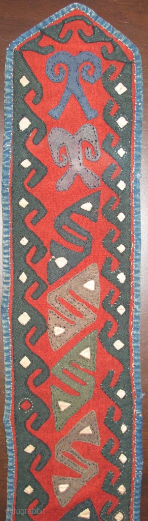 Central Asian Applique Band, red felt-like textile attached to a an old Russian trade cloth attached with indigo dyed cotton binding. Either a belt or perhaps a collar from a garment. Certainly  ...