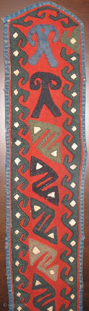 Central Asian Applique Band, red felt-like textile attached to a an old Russian trade cloth attached with indigo dyed cotton binding. Either a belt or perhaps a collar from a garment. Certainly  ...