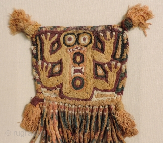 Super cool little Pre-Columbian textile.  This rare, graphic piece was made as tassel or pendant.  The image is that of a frog which is associated with water and fertility. Some  ...