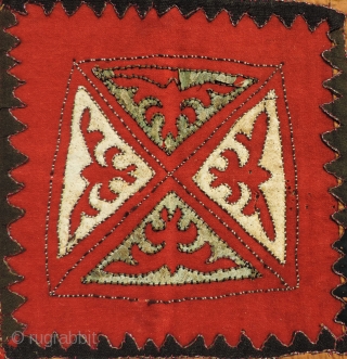 Khirgiz appliqué hanging.  Older than most, this unusual piece has seven different colors of dyed leather used in the appliqué.  It also uses old trade cloth in both wool and  ...