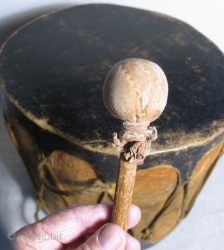 Native American cottonwood drum with original beater. 19th Century, Cochiti Pueblo, New Mexico.  An old, well made example with ceremonial paint remnants still visible. Unlike most old Native American drums this  ...