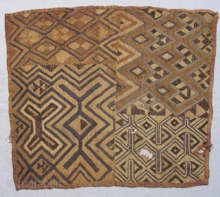 Man's Status Cloth, probably Bushong or Mbeengi people, D.R. Congo, early 20th century.  This unusual "Kuba cloth" panel has a rough and primitive quality that sets it apart from others.   ...