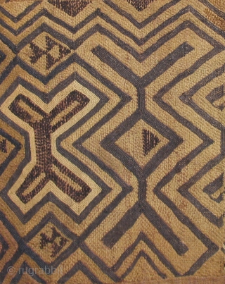 Man's Status Cloth, probably Bushong or Mbeengi people, D.R. Congo, early 20th century.  This unusual "Kuba cloth" panel has a rough and primitive quality that sets it apart from others.   ...